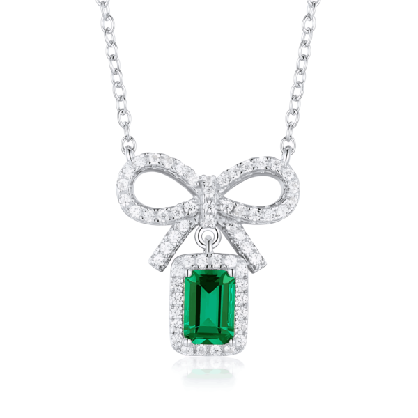 Bow pendant set with cultivated emerald colored gemstone necklace for women